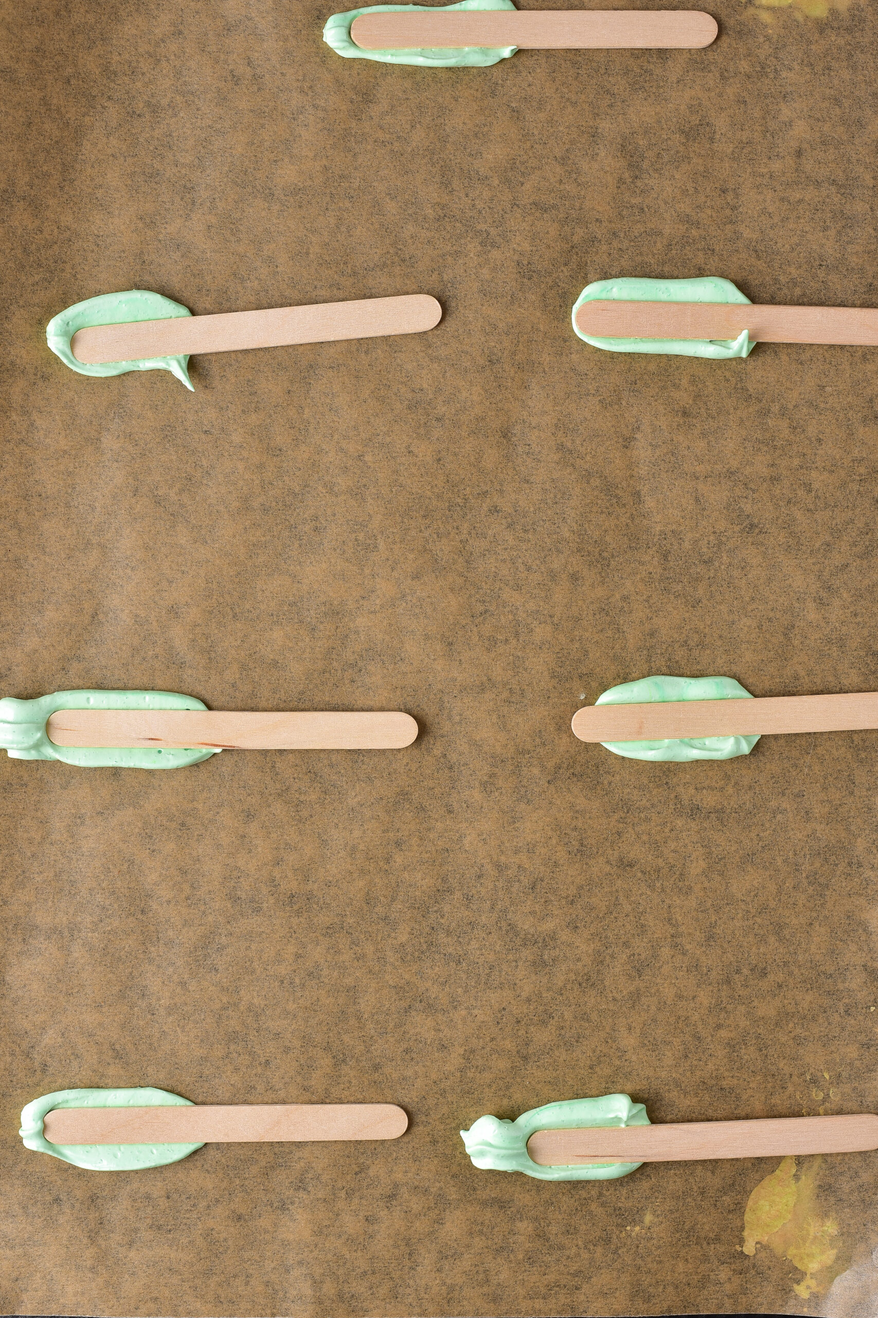 popsicle sticks on meringue